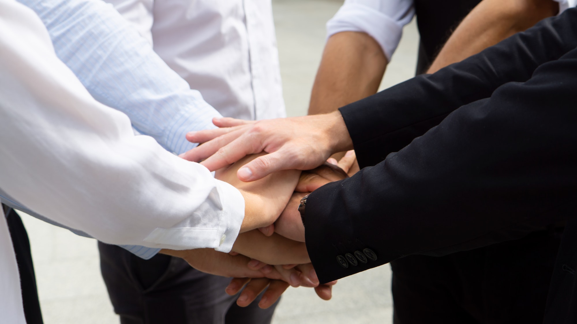 Hands on hand together as unity concept