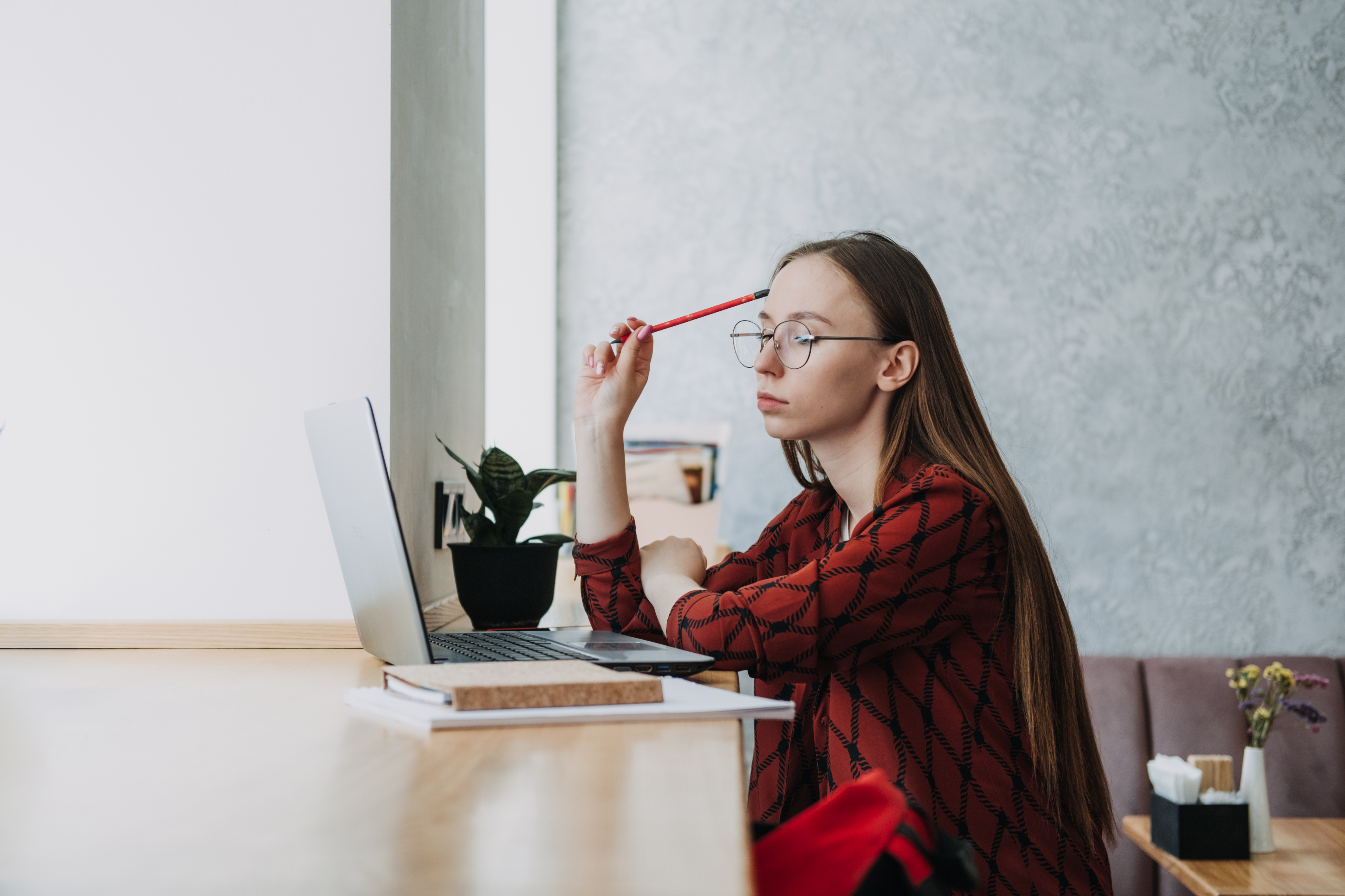College students mental health. Sad and frustrated teenager student girl sitting with laptop